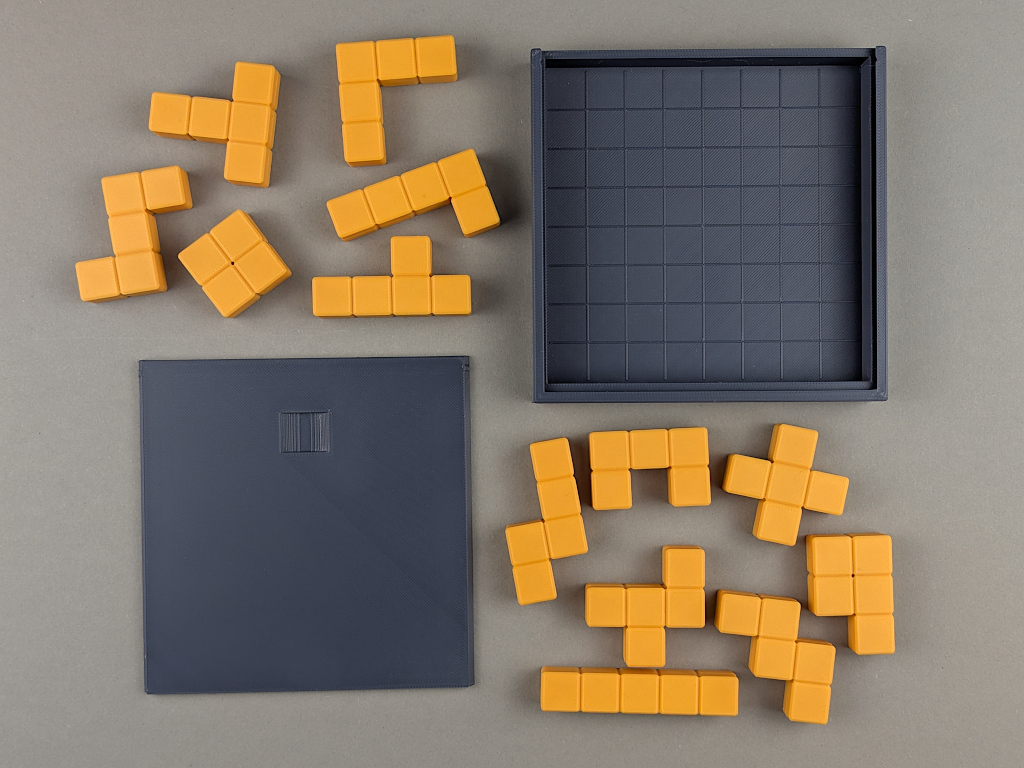 3D printed pentomino puzzle pieces with box